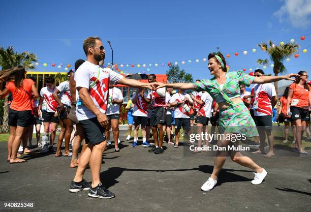 Member of Team England dances with a performer during the Team England welcome ceremony at the Athletes Village ahead of the 2018 Commonwealth Games...