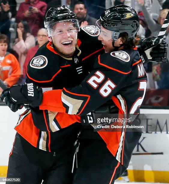 Ondrej Kase and Brandon Montour of the Anaheim Ducks celebrate Kase's overtime goal as the Ducks defeat the Colorado Avalanche 4-3 in the game at...