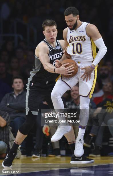 Bogdan Bogdanovic of the Sacramento Kings and Tyler Ennis of the Los Angeles Lakers battle for the ball in the second half at Staples Center on April...
