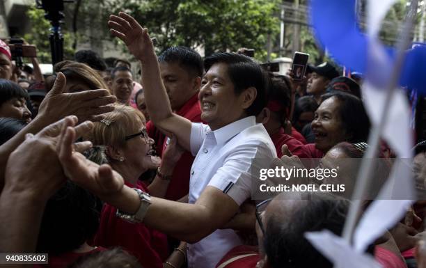 Ferdinand "Bongbong" Marcos Jnr, former senator and son of the late dictator Ferdinand Marcos, is surrounded by supporters after attending the...
