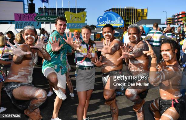 Riley Day of Australia poses with performers following the Team Australia welcome ceremony at the Athletes Village ahead of the 2018 Commonwealth...