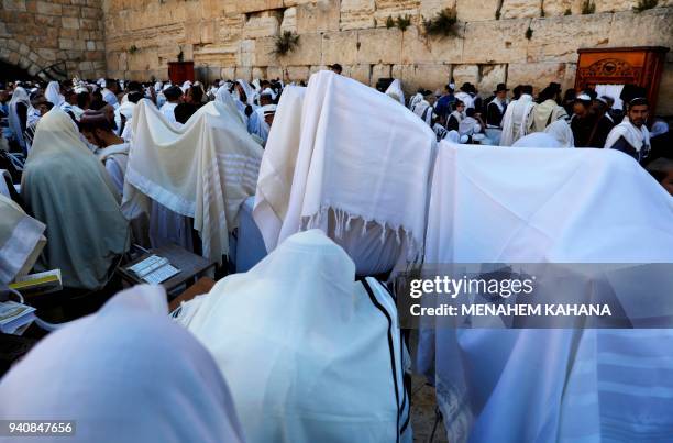 Jewish priests wearing "Talit" take part in the Cohanim prayer during the Passover holiday at the Western Wall in the Old City of Jerusalem, on April...