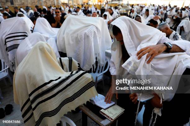 Jewish priests wearing "Talit" take part in the Cohanim prayer during the Passover holiday at the Western Wall in the Old City of Jerusalem, on April...