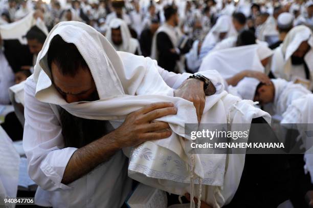 Jewish priests wearing "Talit" take part in the Cohanim prayer during the Passover holiday at the Western Wall in the Old City of Jerusalem, on April...