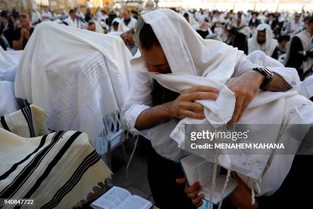 Jewish priests wearing "Talit" take part in the Cohanim prayer during the Passover holiday at the Western Wall in the Old City of Jerusalem, on April...