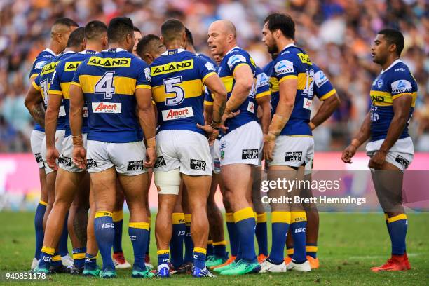 Beau Scott of the Eels speaks with team mates during the round four NRL match between the Wests Tigers and the Parramatta Eels at ANZ Stadium on...