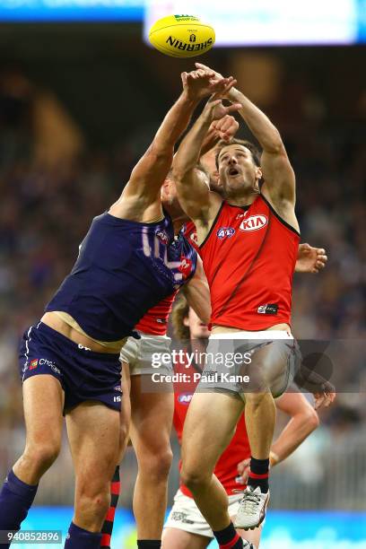 Matt Dea of the Bombers contest for a mark against Aaron Sandilands of the Dockers during the round two AFL match between the Fremantle Dockers and...