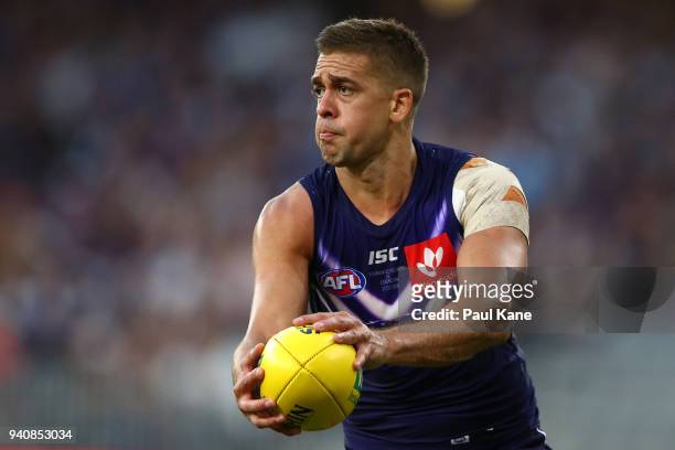 Stephen Hill of the Dockers looks to pss the ball during the round two AFL match between the Fremantle Dockers and the Essendon Bombers at Optus...