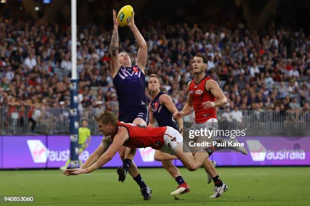 Cam McCarthy of the Dockers marks the ball during the round two AFL match between the Fremantle Dockers and the Essendon Bombers at Optus Stadium on...