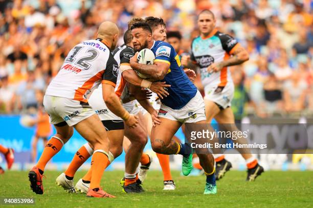 Kenneth Edwards of the Eels is tackled during the round four NRL match between the Wests Tigers and the Parramatta Eels at ANZ Stadium on April 2,...