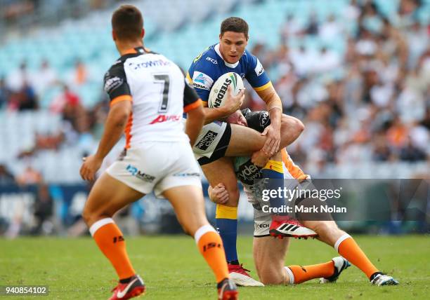 Mitchell Moses of the Eels is tackled during the round four NRL match between the Wests Tigers and the Parramatta Eels at ANZ Stadium on April 2,...