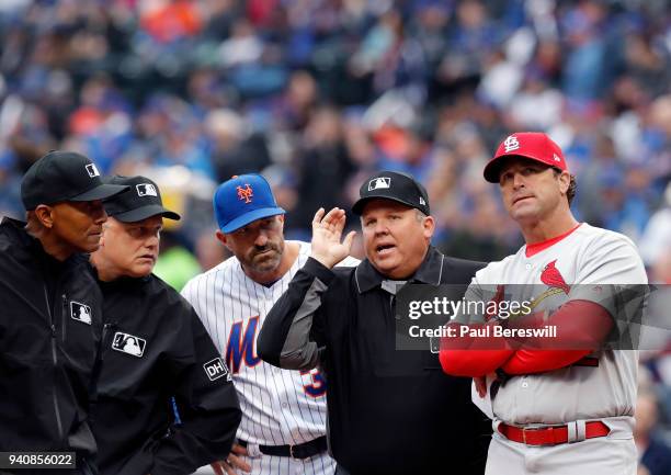 Home plate umpire Fieldin Culbreth goes over the stadium ground rules with Managers Mickey Callaway of the New York Mets and Mike Matheny of the St....