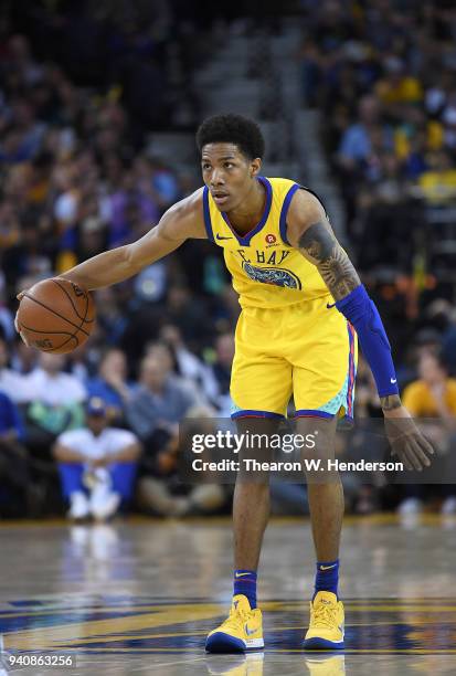 Patrick McCaw of the Golden State Warriors dribbles the ball against the Milwaukee Bucks during an NBA basketball game at ORACLE Arena on March 29,...