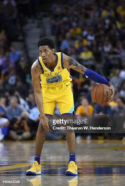 Patrick McCaw of the Golden State Warriors dribbles the ball against the Milwaukee Bucks during an NBA basketball game at ORACLE Arena on March 29,...