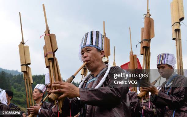 Dong people perform during a wrestling competition at Kengdong Village on March 31, 2018 in Qiandongnan Miao and Dong Prefecture, Guizhou Province of...