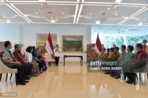 Indonesia's Foreign Minister Retno Marsudi delivers a speech at a government handover ceremony reuniting a group of captives recently returned from...