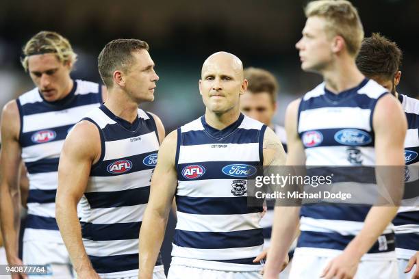 Joel Selwood of the Cats and Gary Ablett look dejected walking off after defeat during the round two AFL match between the Geelong Cats and the...