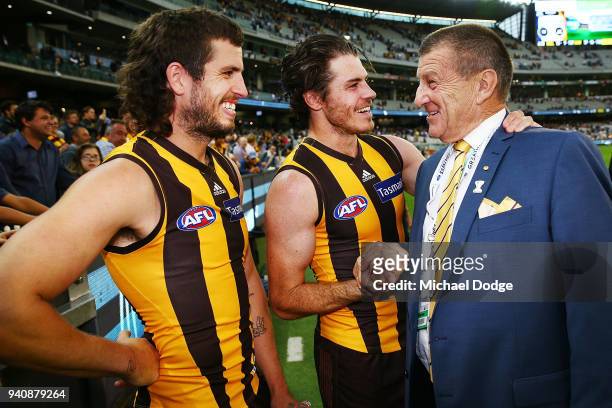 Ben Stratton of the Hawks Isaac Smith celebrate the win Hawks President Jeff Kennett during the round two AFL match between the Geelong Cats and the...