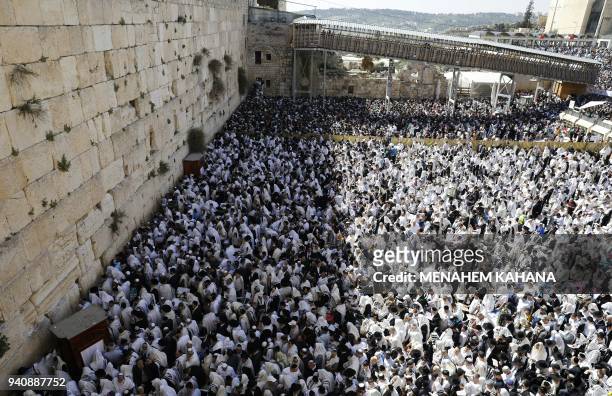 Jewish priests wearing "Talit" and civilians take part in the Cohanim prayer during the Passover holiday at the Western Wall in the Old City of...