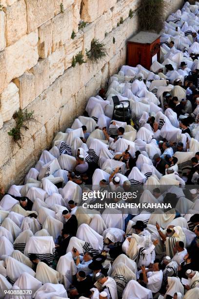 Jew priests wearing "Talit" and civilians take part in the Cohanim prayer during the Passover holiday at the Western Wall in the Old City of...