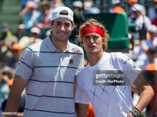 John Isner, from the USA and Alexander Zverev, from Germany, poses for the cameras before the Miami Open final in Key Biscayne in Key Biscayne, on...