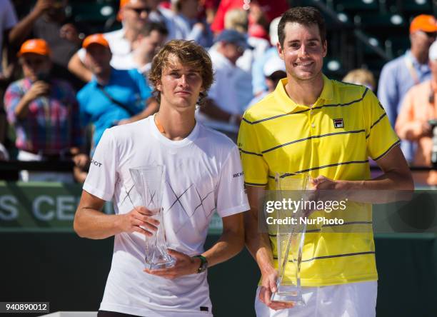 Miami Open Champion John Isner, from the USA, and Alexander Zverez, from Germany, poses for the camera with their Miami Open trophies in Key...