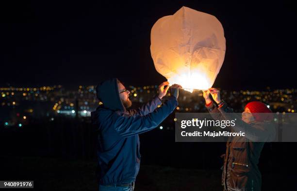 flying lantern - lampion imagens e fotografias de stock
