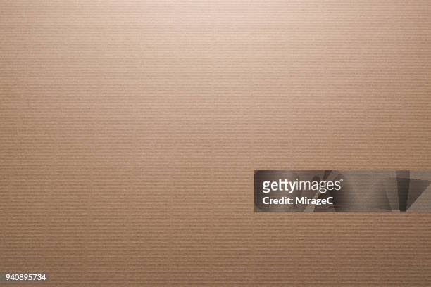 brown color corrugated cardboard - papier kraft photos et images de collection