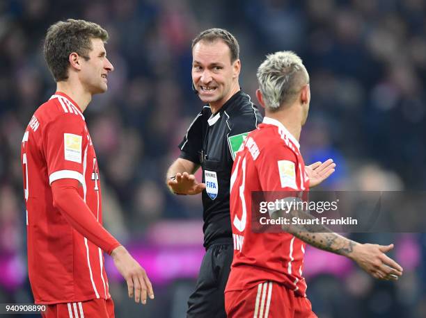 Referee Bastian Dankert gestures during the Bundesliga match between FC Bayern Muenchen and Borussia Dortmund at Allianz Arena on March 31, 2018 in...