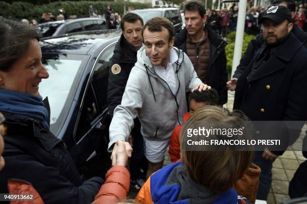 French president Emmanuel Macron shakes hands with wellwishers, on April 2, 2018 in Le Touquet, where he spends the Eastern weekend.