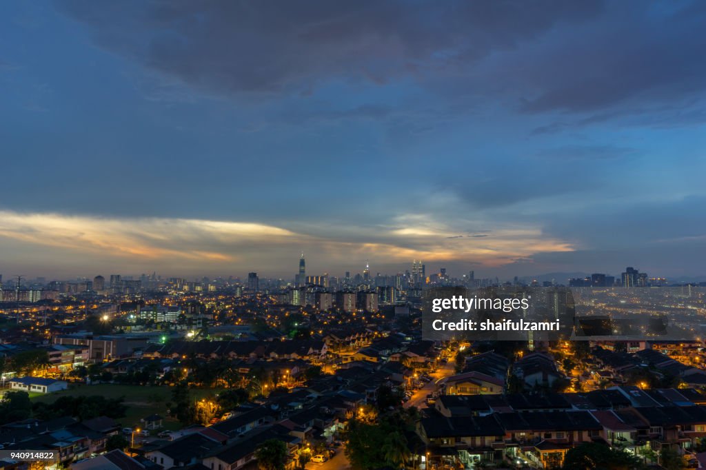 View of sunset at downtown Kuala Lumpur. Its modern skyline is dominated by the 451m tall Petronas Twin Towers, pair of of glass-and-steel-clad skyscraper.