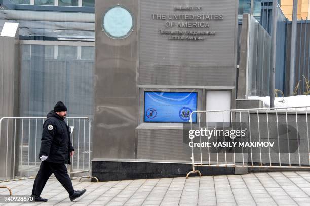 Security officer walks past the building of the embassy of the United States of America in Moscow on April 2, 2018. Russian Foreign Minister Sergei...