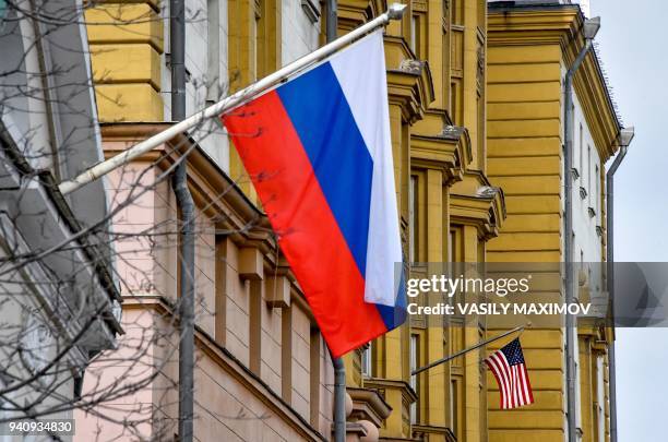 National flag waves on the building of the embassy of the United States of America in Moscow on April 2, 2018. - Russian Foreign Minister Sergei...