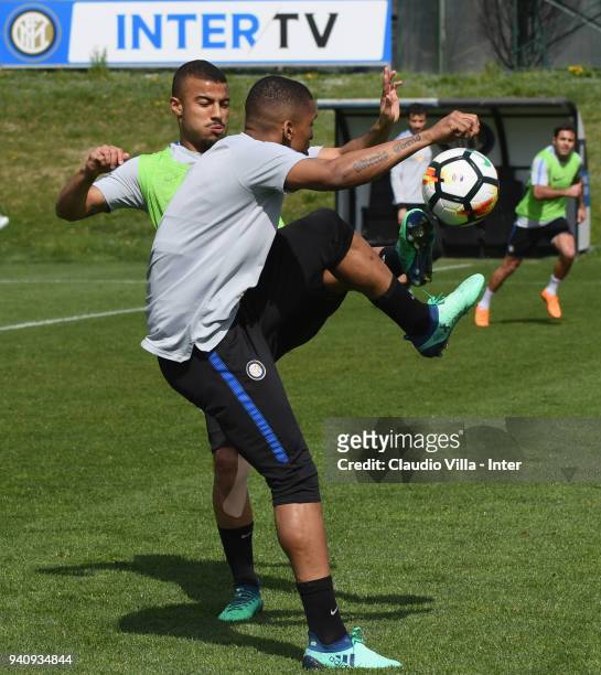 Rafinha and Dalbert Henrique Chagas Estevão of FC Internazionale in action during the FC Internazionale training session at the Angelo Moratti Sports...