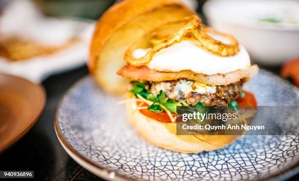 homemade burger with bacon, egg, and fried onion - hanoi bar stock pictures, royalty-free photos & images