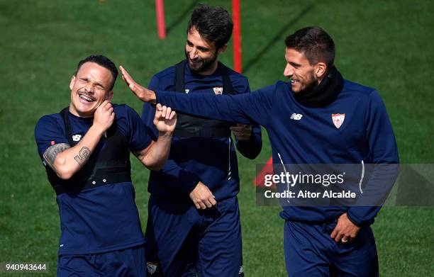 Roque Mesa of Sevilla FC Nicolas Pareja of Sevilla FC and Daniel Carrico of Sevilla FC looks on during the training session prior to their UEFA...