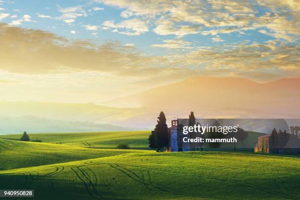 landscape in tuscany with the capella di vitaleta - capella di vitaleta stock pictures, royalty-free photos & images