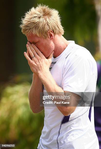 Adam McPhee applies sunscreen after arriving to train with the Dockers during a Fremantle Dockers AFL training session at Santich Park on December 7,...