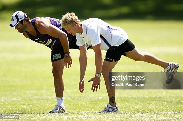 Dean Solomon of the Dockers and Adam McPhee warm up during a Fremantle Dockers AFL training session at Santich Park on December 7, 2009 in Fremantle,...