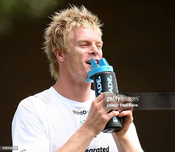 Adam McPhee takes a drink after arriving to train with the Dockers during a Fremantle Dockers AFL training session at Santich Park on December 7,...