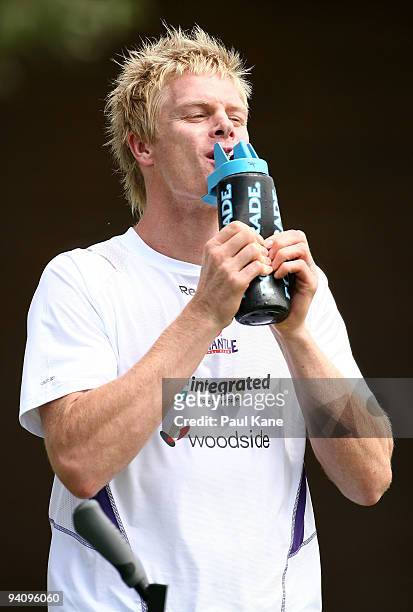 Adam McPhee takes a drink after arriving to train with the Dockers during a Fremantle Dockers AFL training session at Santich Park on December 7,...