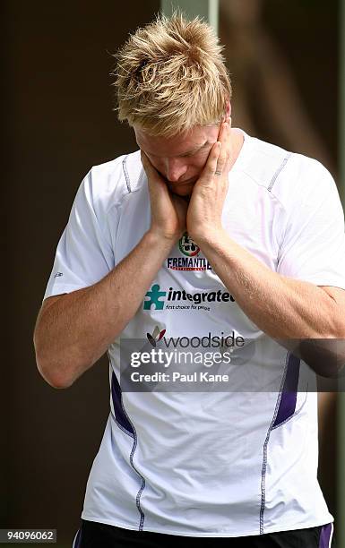 Adam McPhee applies sunscreen after arriving to train with the Dockers during a Fremantle Dockers AFL training session at Santich Park on December 7,...