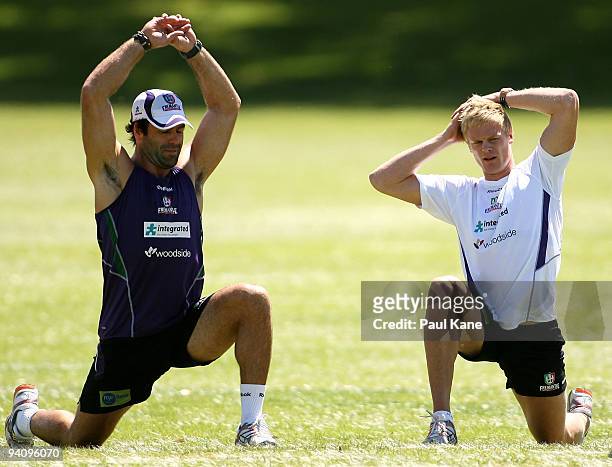Dean Solomon of the Dockers and Adam McPhee warm up during a Fremantle Dockers AFL training session at Santich Park on December 7, 2009 in Fremantle,...