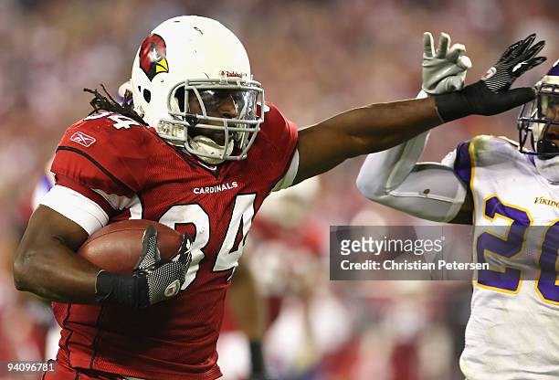 Runningback Tim Hightower of the Arizona Cardinals rushes the ball against Madieu Williams of the Minnesota Vikings during the NFL game at the...