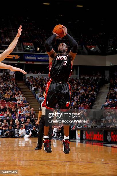 Dwyane Wade of the Miami Heat shoots the ball against the Sacramento Kings on December 6, 2009 at ARCO Arena in Sacramento, California. NOTE TO USER:...