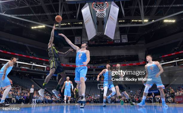 Taurean Prince of the Atlanta Hawks shoots against Kosta Koufos of the Sacramento Kings on March 22, 2018 at Golden 1 Center in Sacramento,...