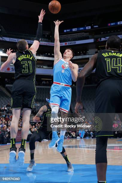 Bogdan Bogdanovic of the Sacramento Kings shoots against Mike Muscala of the Atlanta Hawks on March 22, 2018 at Golden 1 Center in Sacramento,...