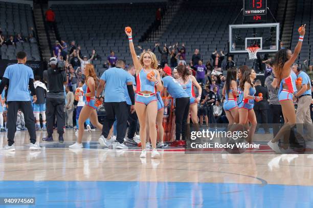 The Sacramento Kings dance team tosses out mini basketballs to the limited fans in attendance of the game against the Atlanta Hawks on March 22, 2018...