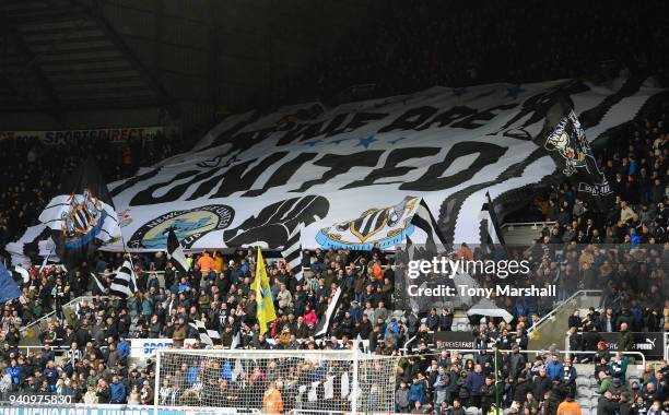 Fans of Newcastle United unvail a giant flag in the stand during the Premier League match between Newcastle United and Huddersfield Town at St. James...