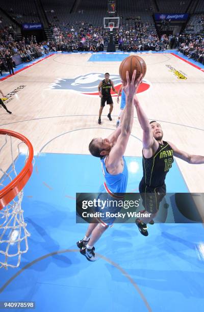 Kosta Koufos of the Sacramento Kings rebounds against Mike Muscala of the Atlanta Hawks on March 22, 2018 at Golden 1 Center in Sacramento,...